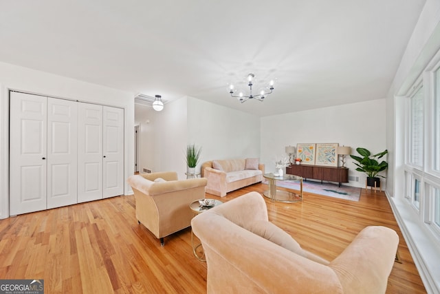 3222 Edgemont Way, Decatur, GA 30032 - living room with a chandelier and light wood finished floors