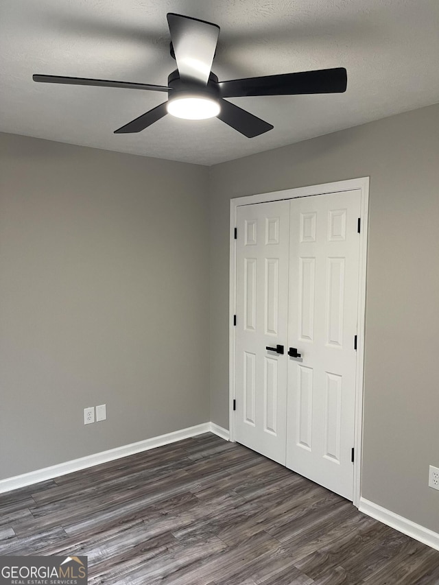 105 Ridgefield Dr, Lagrange, GA 30241 - unfurnished bedroom with dark wood-type flooring, a closet, and a ceiling fan