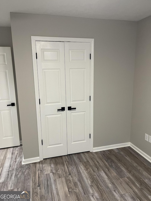 105 Ridgefield Dr, Lagrange, GA 30241 - unfurnished bedroom with a closet and wood finished floors