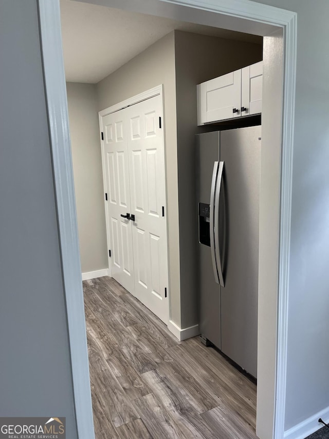 105 Ridgefield Dr, Lagrange, GA 30241 - kitchen featuring stainless steel fridge, wood finished floors, and white cabinets