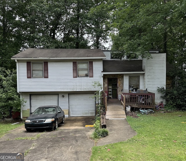 6884 Red Maple Ct, Rex, GA 30273 - split level home featuring driveway, an attached garage, a front yard, a chimney, and a shingled roof