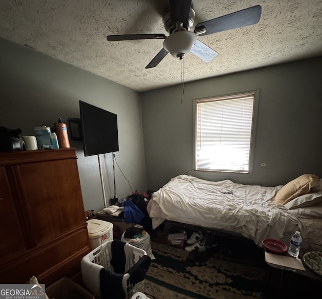 6884 Red Maple Ct, Rex, GA 30273 - bedroom with a textured ceiling and a ceiling fan