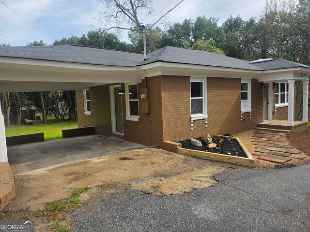 1425 Walls Ln, Macon, GA 31211 - view of front of house with brick siding and an attached carport