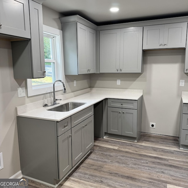 1425 Walls Ln, Macon, GA 31211 - kitchen featuring gray cabinets, light countertops, light wood-type flooring, and recessed lighting