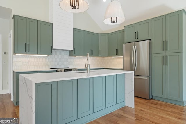 631 Susan Davis Rd, Sparta, GA 31087 - kitchen with freestanding refrigerator, tasteful backsplash, green cabinets, and vaulted ceiling