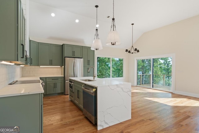 631 Susan Davis Rd, Sparta, GA 31087 - kitchen featuring green cabinets, appliances with stainless steel finishes, backsplash, a chandelier, and hanging light fixtures