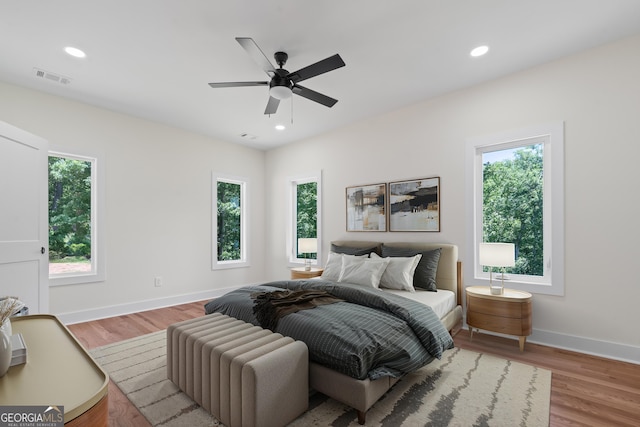 631 Susan Davis Rd, Sparta, GA 31087 - bedroom featuring multiple windows, wood finished floors, recessed lighting, and ceiling fan