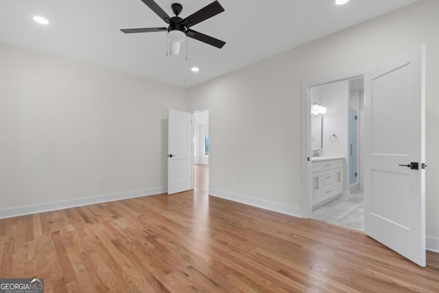 631 Susan Davis Rd, Sparta, GA 31087 - unfurnished bedroom with light wood finished floors, recessed lighting, ensuite bath, and a ceiling fan