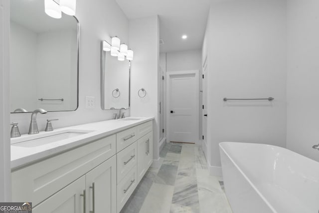 631 Susan Davis Rd, Sparta, GA 31087 - bathroom with marble finish floors, a soaking tub, double vanity, and recessed lighting