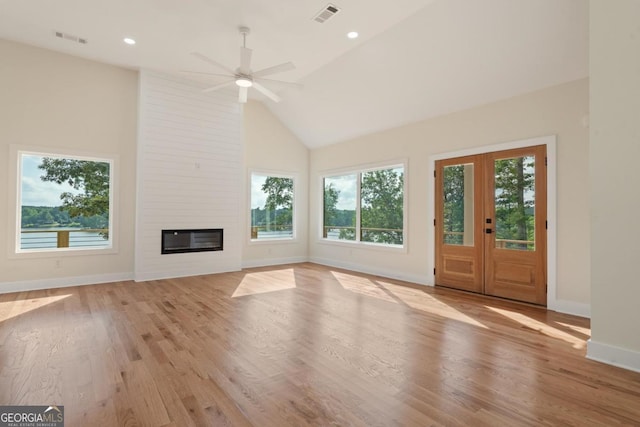 631 Susan Davis Rd, Sparta, GA 31087 - unfurnished living room with healthy amount of natural light, a ceiling fan, light wood finished floors, high vaulted ceiling, and recessed lighting