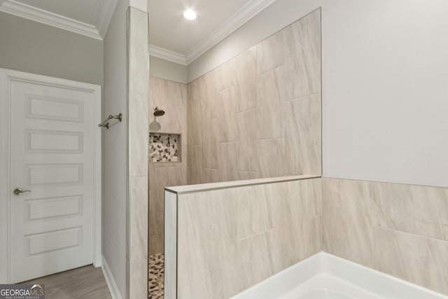 183 Ryan Nicholas Dr, Kingsland, GA 31548 - full bathroom with crown molding, a walk in shower, and a garden tub