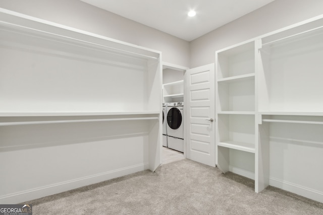 183 Ryan Nicholas Dr, Kingsland, GA 31548 - walk in closet with carpet flooring and washer / clothes dryer