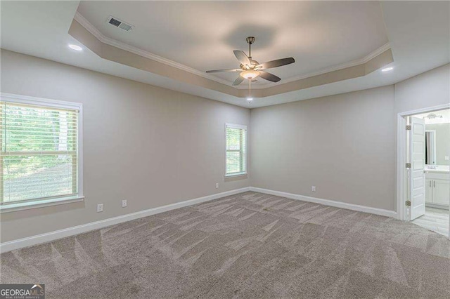 150 Whitworth Dr, Locust Grove, GA 30248 - empty room featuring ornamental molding, ceiling fan, a tray ceiling, light carpet, and recessed lighting