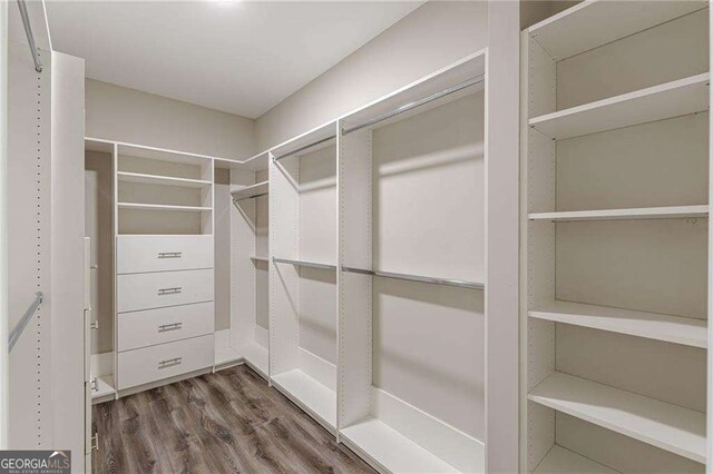 150 Whitworth Dr, Locust Grove, GA 30248 - spacious closet with dark wood-style floors