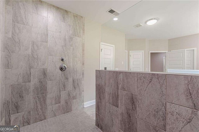150 Whitworth Dr, Locust Grove, GA 30248 - bathroom with tiled shower