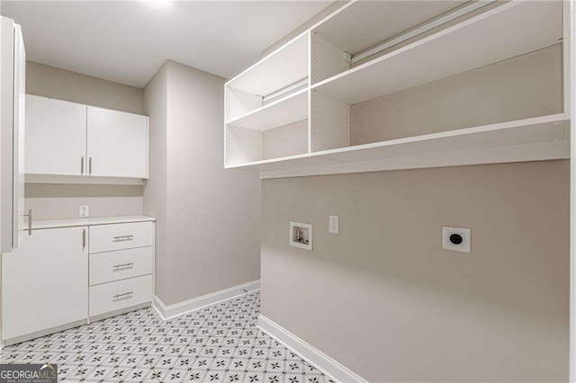 150 Whitworth Dr, Locust Grove, GA 30248 - laundry area featuring electric dryer hookup, washer hookup, cabinet space, and light floors