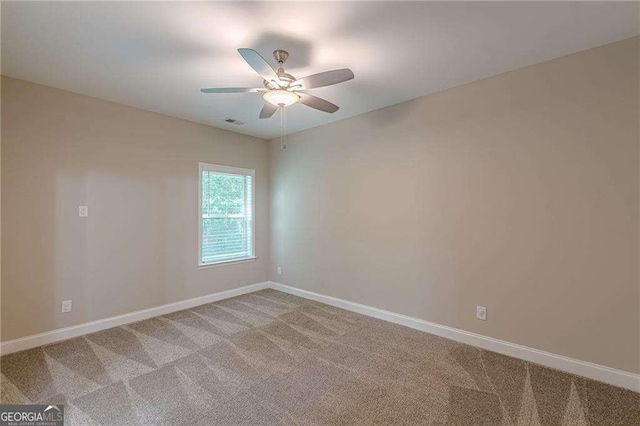 150 Whitworth Dr, Locust Grove, GA 30248 - spare room with light carpet and a ceiling fan