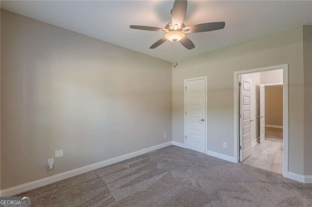 150 Whitworth Dr, Locust Grove, GA 30248 - unfurnished bedroom featuring carpet flooring and a ceiling fan