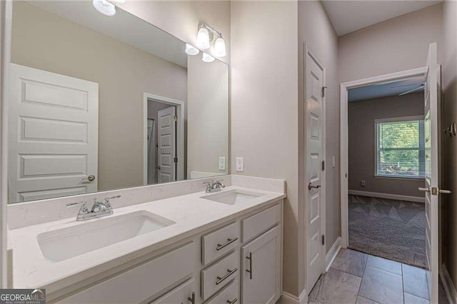 150 Whitworth Dr, Locust Grove, GA 30248 - bathroom with double vanity and baseboards