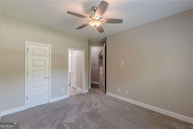 150 Whitworth Dr, Locust Grove, GA 30248 - unfurnished bedroom with carpet floors, ensuite bathroom, and ceiling fan