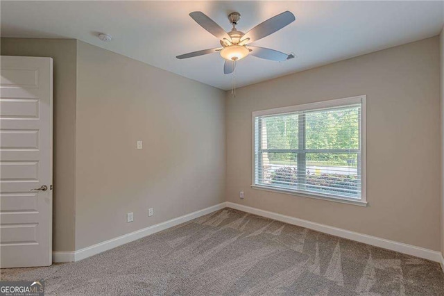 150 Whitworth Dr, Locust Grove, GA 30248 - carpeted empty room with a ceiling fan and a smoke detector