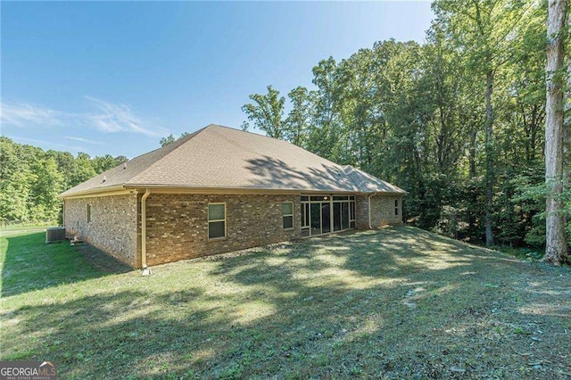 150 Whitworth Dr, Locust Grove, GA 30248 - rear view of property featuring brick siding and a yard
