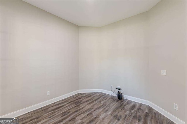 150 Whitworth Dr, Locust Grove, GA 30248 - empty room with dark wood-type flooring and baseboards