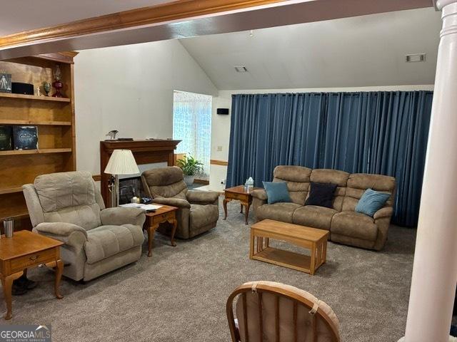 9361 Arbor Glenn Ct, Jonesboro, GA 30263 - carpeted living area with vaulted ceiling and ornate columns