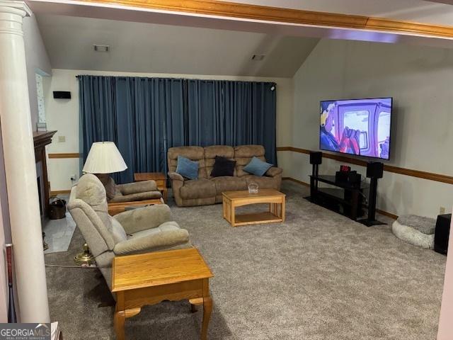 9361 Arbor Glenn Ct, Jonesboro, GA 30263 - living area with vaulted ceiling, carpet, and decorative columns