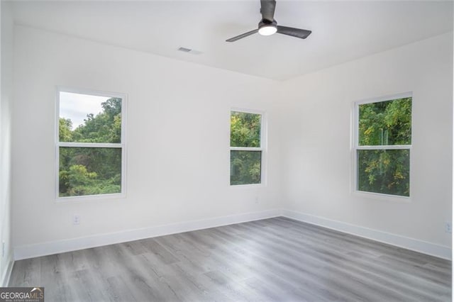 2312 Herring, Atlanta, GA 30311 - spare room featuring healthy amount of natural light, wood finished floors, and ceiling fan