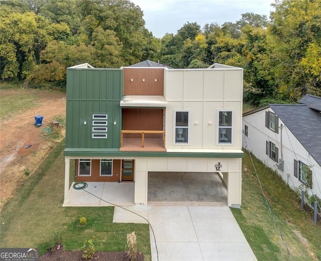 2312 Herring, Atlanta, GA 30311 - view of front of property featuring a carport, a front lawn, driveway, and a balcony