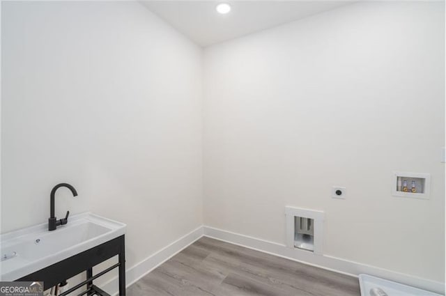 2312 Herring, Atlanta, GA 30311 - laundry area featuring hookup for an electric dryer, washer hookup, wood finished floors, and recessed lighting