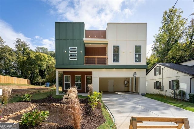 2312 Herring, Atlanta, GA 30311 - contemporary house with board and batten siding, driveway, and a balcony