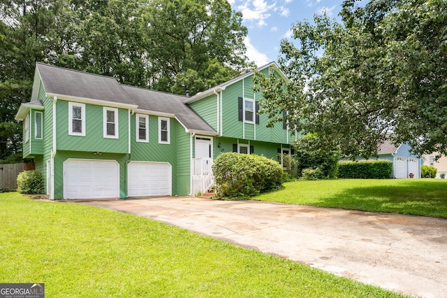 936 Tyrell Dr, Austell, GA 30106 - tri-level home with concrete driveway and an attached garage