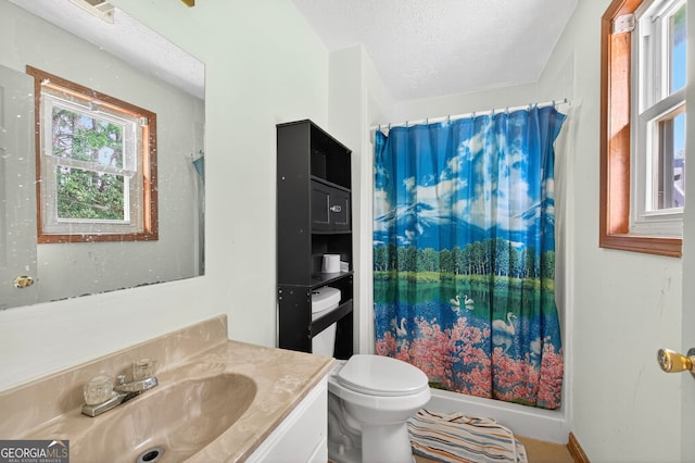 936 Tyrell Dr, Austell, GA 30106 - bathroom featuring a textured ceiling, vanity, and shower / bath combo with shower curtain