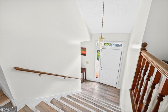 936 Tyrell Dr, Austell, GA 30106 - foyer with wood finished floors, vaulted ceiling, and a textured ceiling