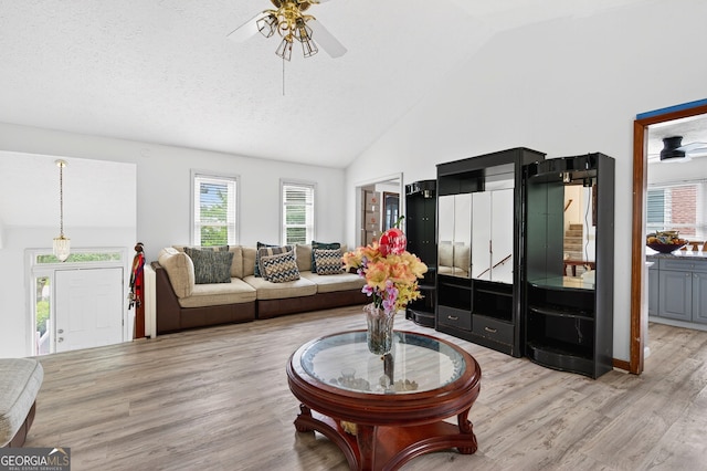 936 Tyrell Dr, Austell, GA 30106 - living area featuring a ceiling fan, light wood-type flooring, and high vaulted ceiling