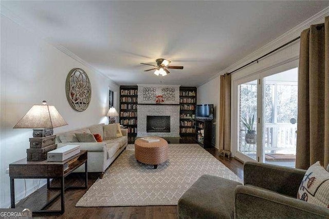 160 Edgewood Dr, Athens, GA 30606 - living room with crown molding, ceiling fan, wood finished floors, healthy amount of natural light, and a fireplace
