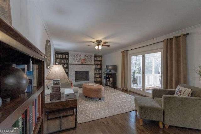 160 Edgewood Dr, Athens, GA 30606 - living room with ornamental molding, wood finished floors, a ceiling fan, and a brick fireplace