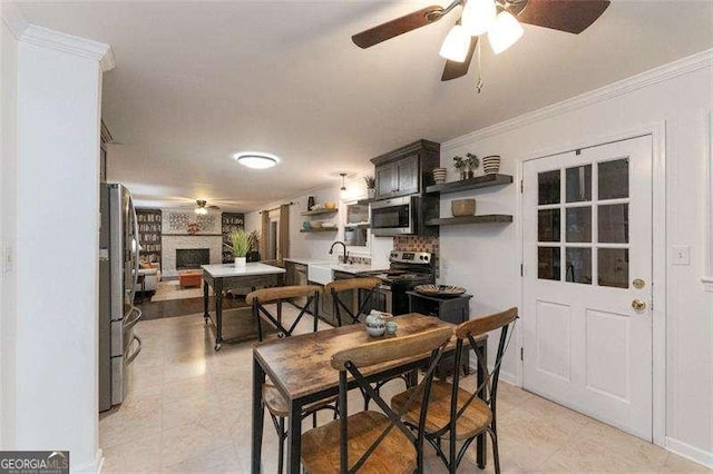 160 Edgewood Dr, Athens, GA 30606 - dining area featuring a ceiling fan, crown molding, light tile patterned flooring, and a fireplace
