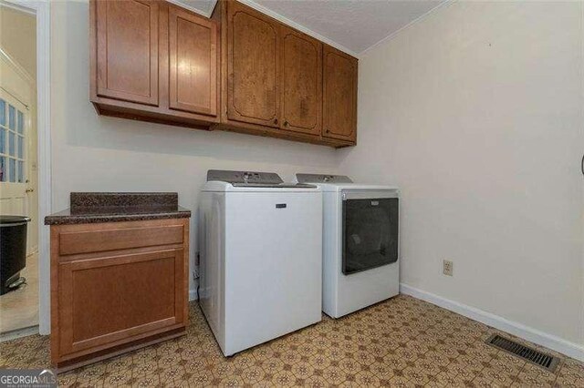 160 Edgewood Dr, Athens, GA 30606 - laundry area with cabinet space, independent washer and dryer, light flooring, and crown molding