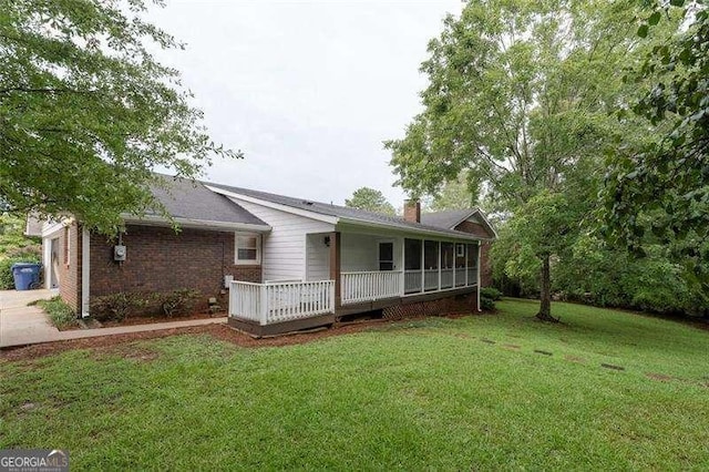 160 Edgewood Dr, Athens, GA 30606 - rear view of property featuring a lawn, a chimney, and brick siding