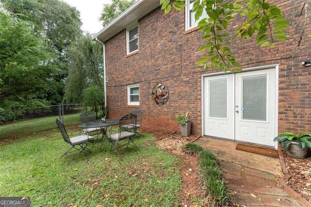 160 Edgewood Dr, Athens, GA 30606 - view of property exterior featuring french doors and brick siding