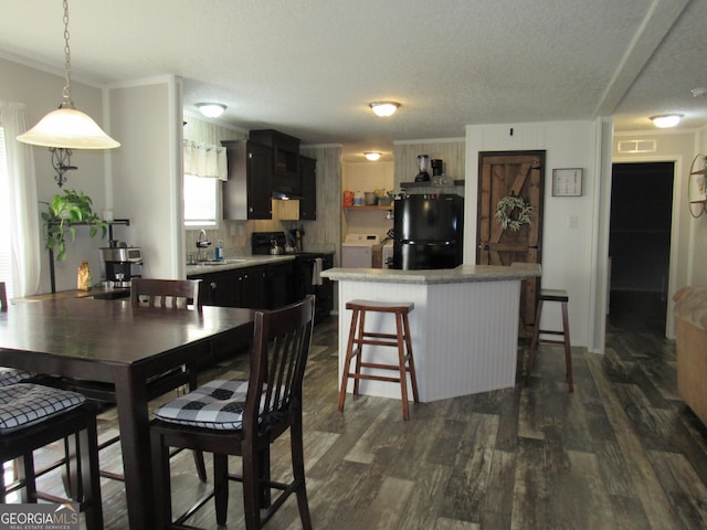 14 Henderson Rd, Cleveland, GA 30528 - dining room with washer / dryer, dark wood-style floors, a textured ceiling, and crown molding