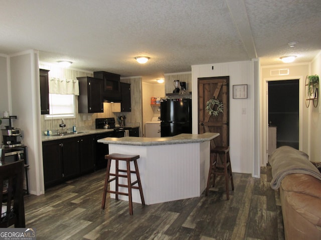 14 Henderson Rd, Cleveland, GA 30528 - kitchen featuring black appliances, dark wood-type flooring, dark cabinetry, and a textured ceiling