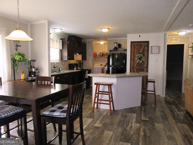 14 Henderson Rd, Cleveland, GA 30528 - dining space featuring washer / clothes dryer, dark wood-style flooring, a textured ceiling, and crown molding