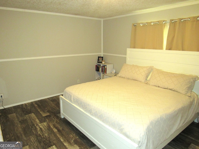 14 Henderson Rd, Cleveland, GA 30528 - bedroom with dark wood-style flooring, a textured ceiling, and crown molding