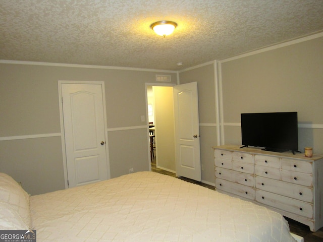14 Henderson Rd, Cleveland, GA 30528 - bedroom with a textured ceiling and crown molding