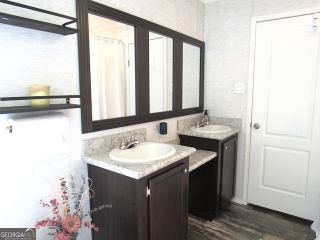 14 Henderson Rd, Cleveland, GA 30528 - bathroom featuring two vanities and wood finished floors