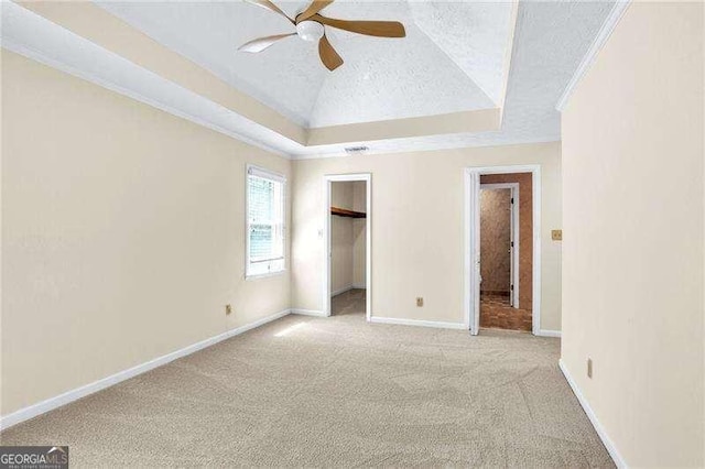 2830 Scottish Mill Way, Marietta, GA 30068 - unfurnished bedroom featuring carpet flooring, a raised ceiling, a textured ceiling, ceiling fan, and a spacious closet